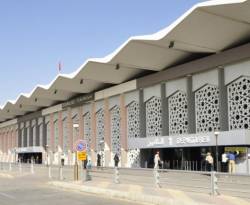 إزالة صور بشار الأسد من مطار دمشق الدولي