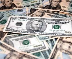 الدولار ينهي أسوأ عام له منذ 2003، وعملة بيتكوين تقفز 1400 بالمئة في 2017