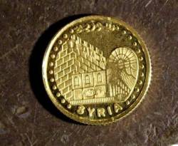 الذهب يتراجع بدمشق بدفع من الأسعار العالمية