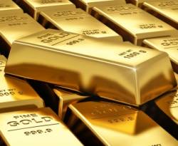 الذهب يتراجع مع صعود الدولار في نهاية ثاني أسبوع من الخسائر