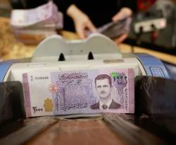 تقرير: رجال أعمال الأسد يعيقون تعافي القطاع المصرفي السوري