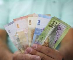 مركز اقتصادي موالٍ للنظام يتهم تركيا بالمسؤولية عن تراجع سعر صرف الليرة