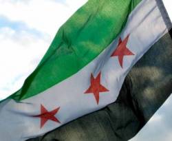 استياء وجدل جرّاء اعتقال الأمن الكويتي لسوريين رفعوا علم الثورة