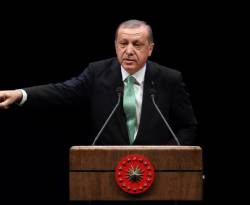 أردوغان يهدد بالسماح بعبور المهاجرين إلى أوروبا