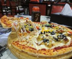 أسعار السندويش والبيتزا بمطاعم دمشق