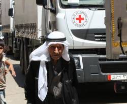 بالصور.. قوافل المساعدات إلى الحولة المحاصرة بريف حمص